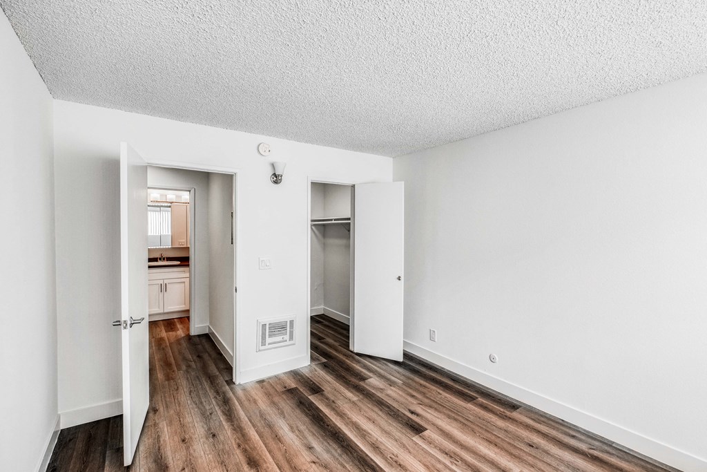 bedroom showing wood like floors