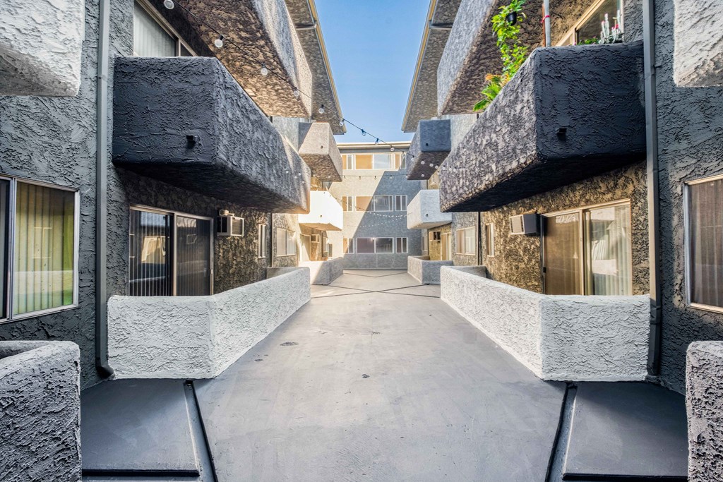 view of corridor between buildings