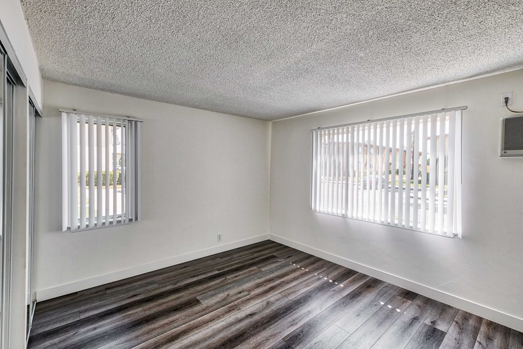 view of bedroom with window blinds at Serrano Apartments, West Covina, CA