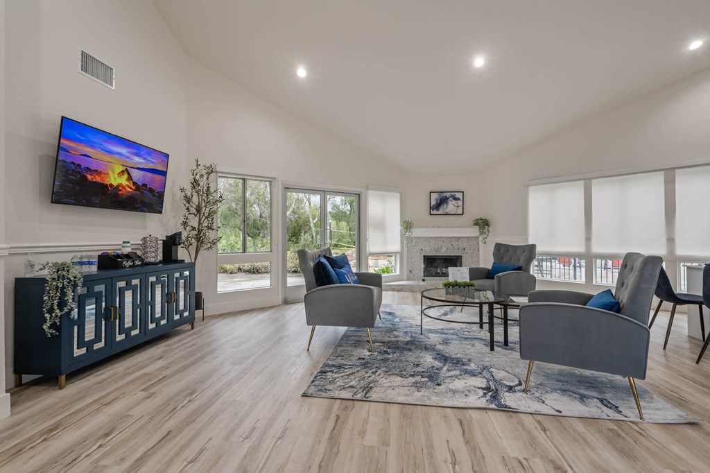 a community room with furniture and a fireplace at Monterra Ridge Apartments, California,91351