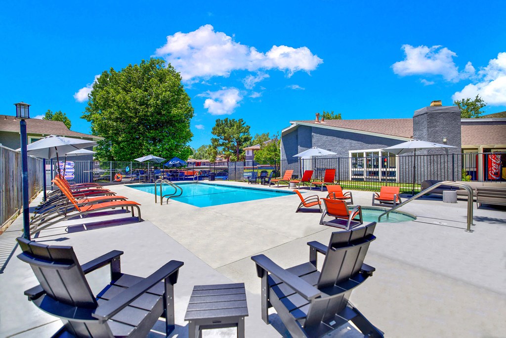 our apartments have a large pool with chairs and tables at Monterra Ridge Apartments,California