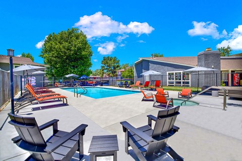 our apartments have a large pool with chairs and tables our apartments have a large pool with chairs and tables at Monterra Ridge Apartments,California