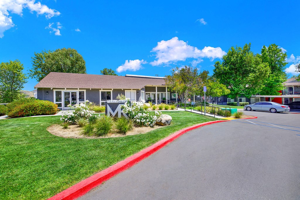 the front of a building with a car parked in front of it at Monterra Ridge Apartments, Canyon Country
