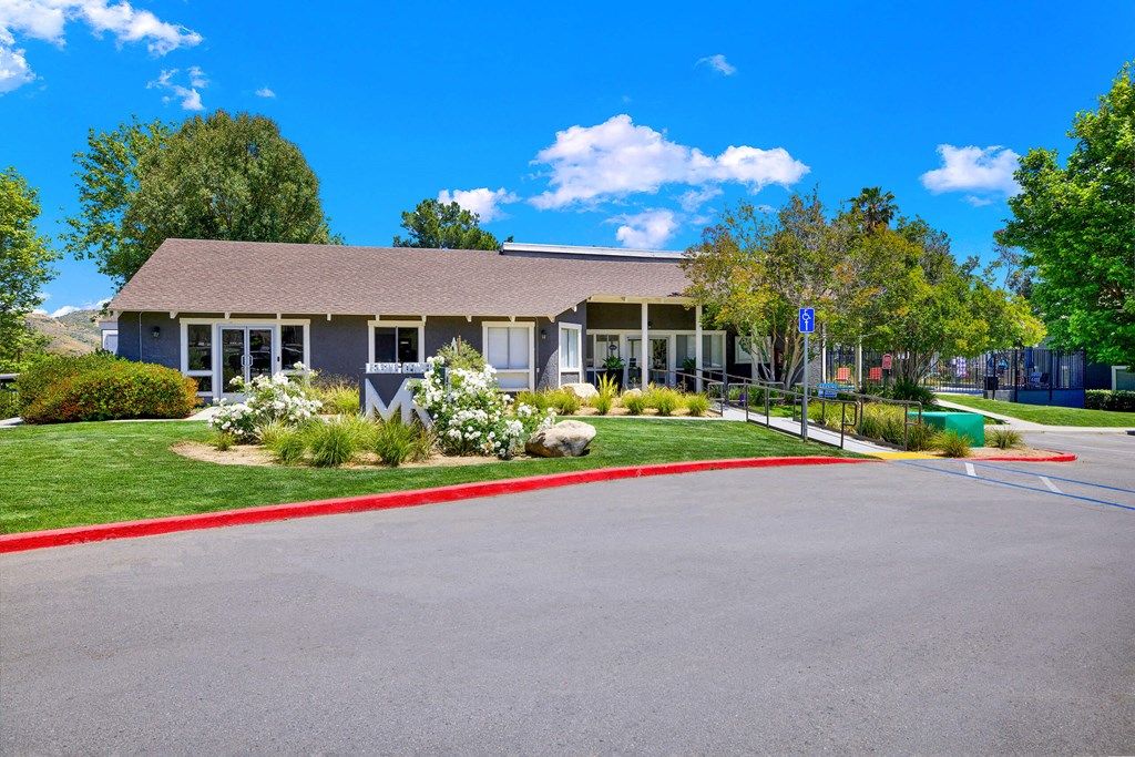 the front of a house with a driveway and a parking lot at Monterra Ridge Apartments, California,91351