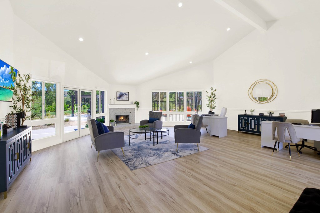 a living room with furniture and a fireplace at Monterra Ridge Apartments, Canyon Country, California
