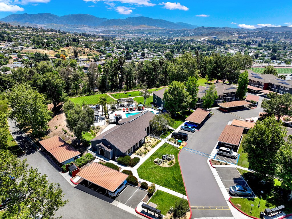 an aerial view of a neighborhood with houses and cars on the street at Monterra Ridge Apartments, Canyon Country