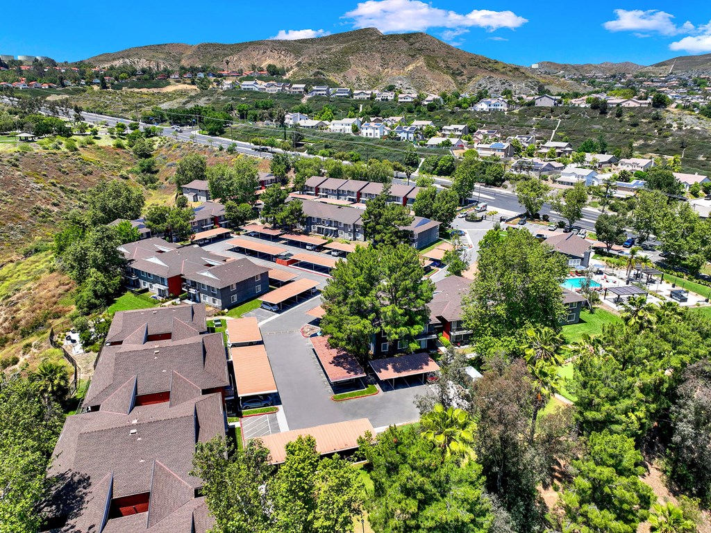 a aerial view of a neighborhood with houses and trees at Monterra Ridge Apartments, Canyon Country