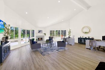 a living room with furniture and a fireplace at Monterra Ridge Apartments, Canyon Country