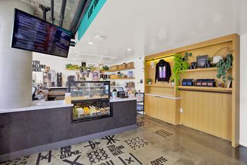 the lobby of a coffee shop with a counter and a tv at the perch, California, 90065
