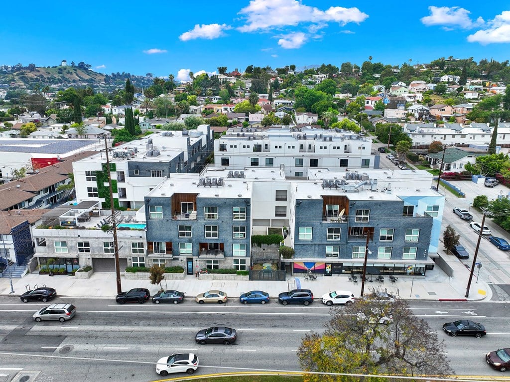 an aerial view of a city with a mountain in the background