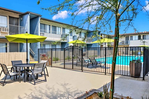 our apartments have a pool and a patio with tables and chairs at Sunset Square Apartments, West Covina, California, 91790