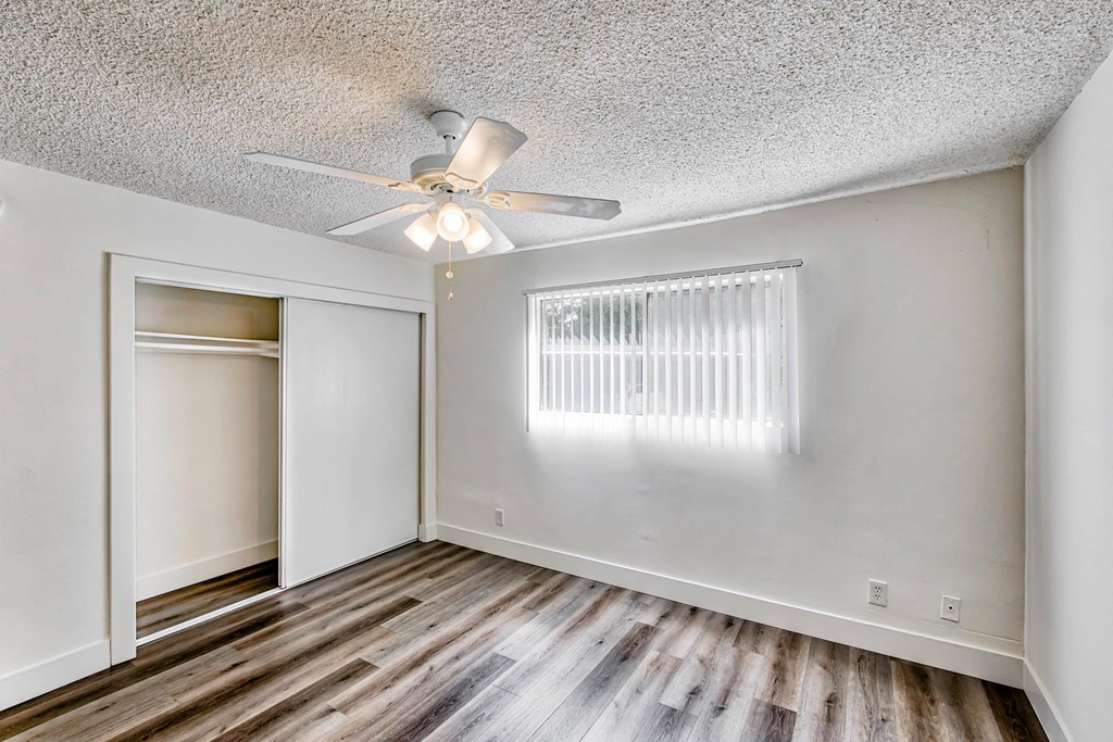 Bedroom with Ceiling fan and window