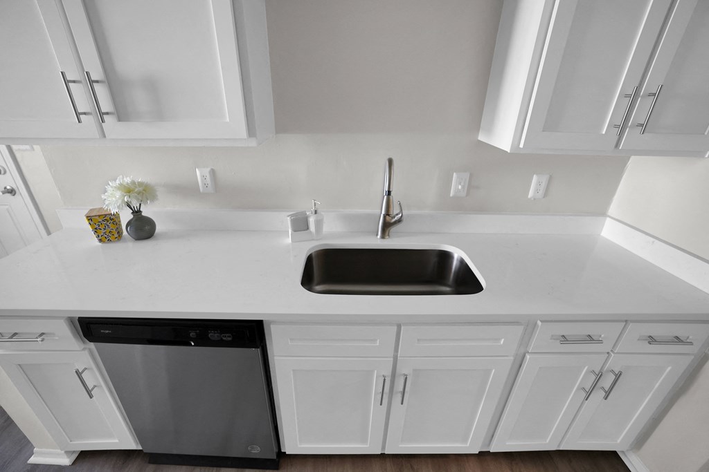 Stainless steel sink with beautiful countertops and cabinets  at Huntington Apartments, North Carolina