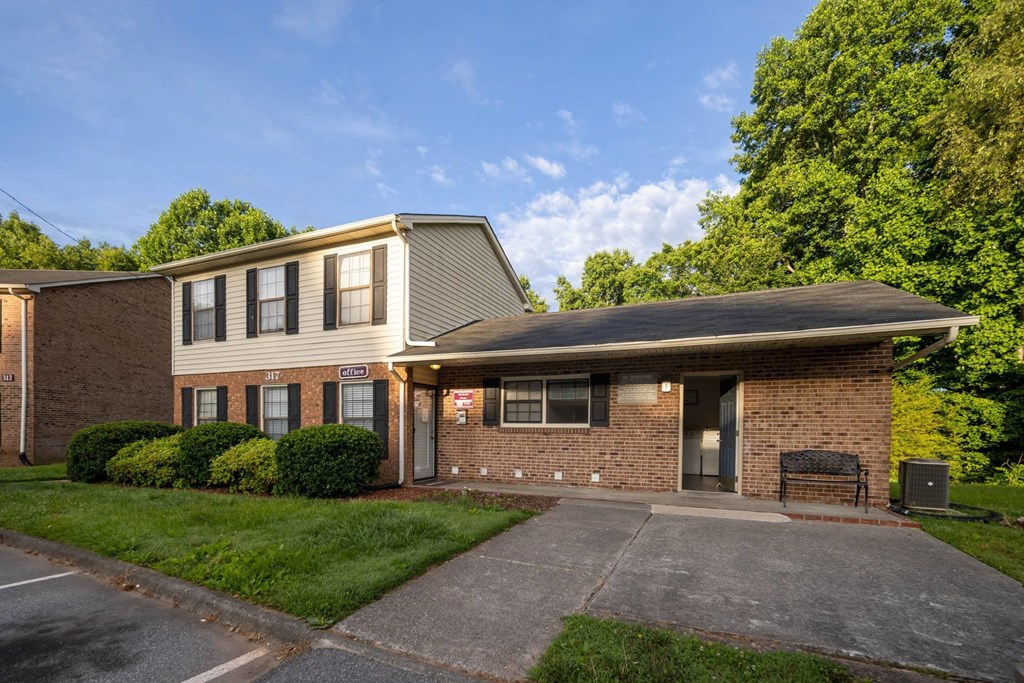 A building with a grey roof and a sign that says "101" on it.