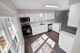 Kitchen view with all appliances and natural light Kitchen view with all appliances at Huntington Apartments, Morrisville, 27560 and natural light