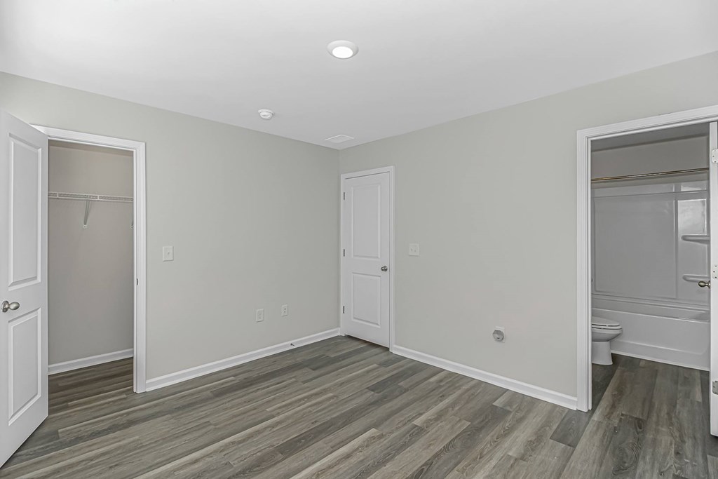 A room with a grey floor and white walls.