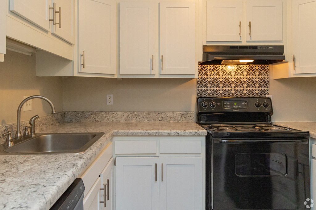 a group of white and black flowers on the floor