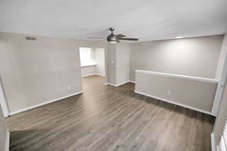 Spacious living area with ceiling fan and hardwood floors Spacious living area with ceiling fan and hardwood floors at Huntington Apartments, North Carolina, 27560