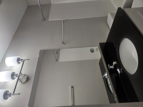 A bathroom with a sink and lights.