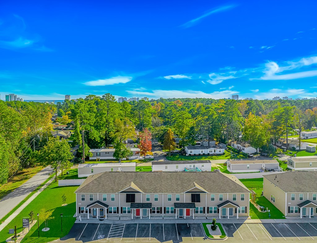 A large building with a parking lot in front of it.