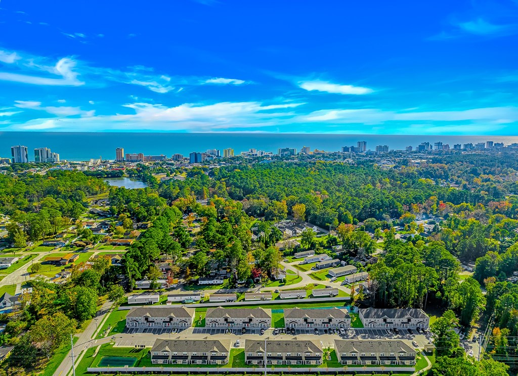 A bird's eye view of a residential area with houses and trees.