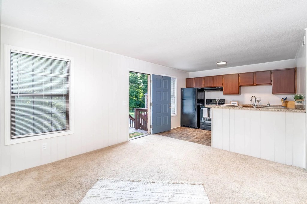 A kitchen area with a blue door and a white counter.