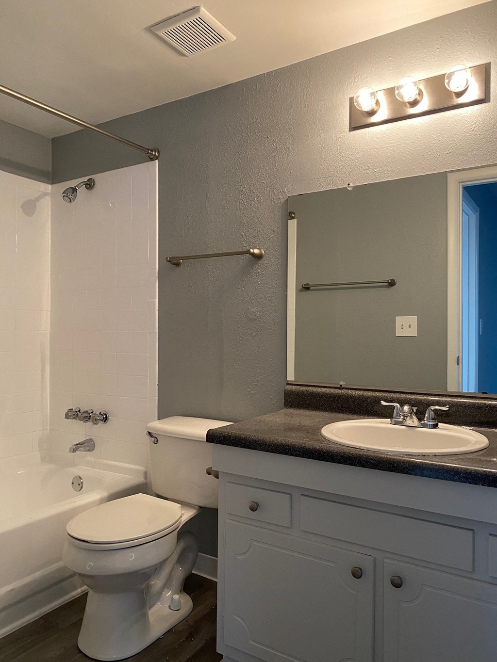a bathroom with a sink toilet and a shower