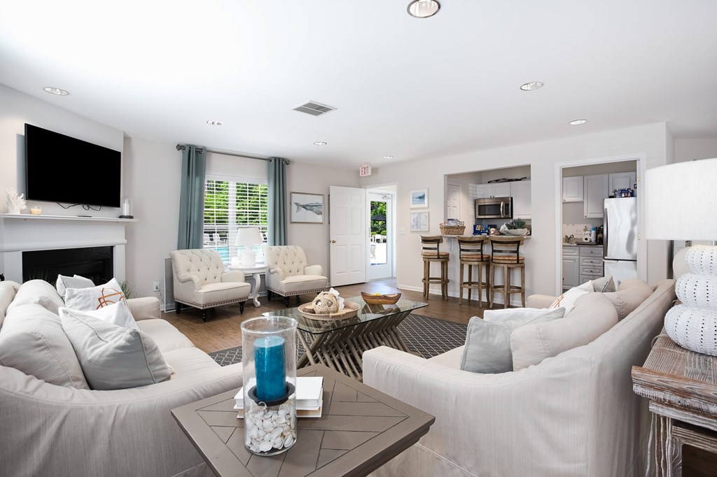 A living room with a grey couch and a coffee table.