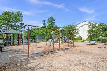 A playground with swings and a slide.