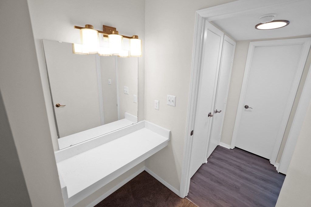 Vanity with mirror and lighting  at Huntington Apartments, Morrisville, NC, 27560