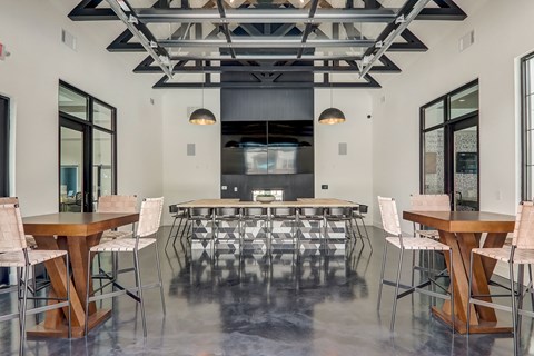 a large room with tables and chairs and a kitchen in the background in Asheville