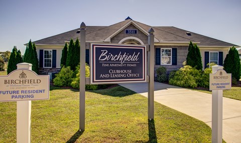 A sign for Birchfield Fine Apartment Homes and Leasing Office.