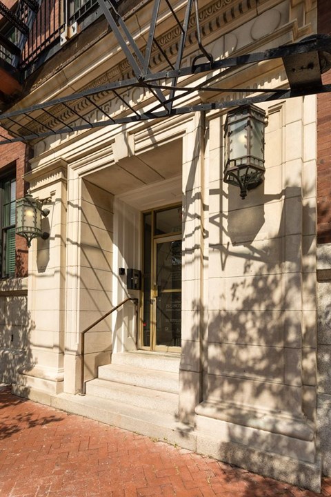 A building with a balcony and a window.