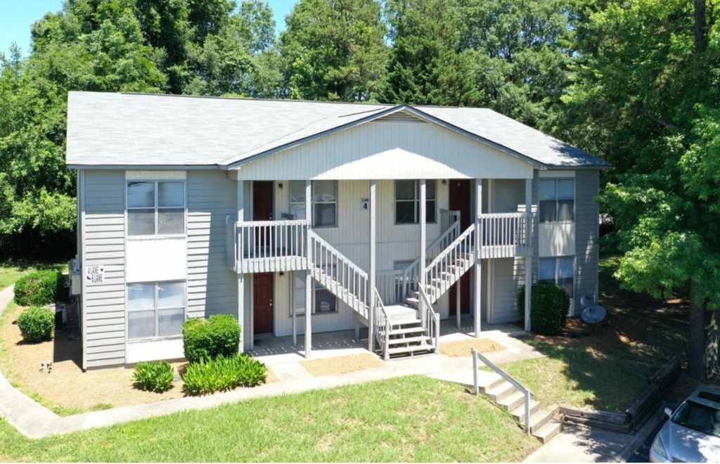 Two Level building surrounded by trees