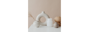 a collection of vases and pots on a table