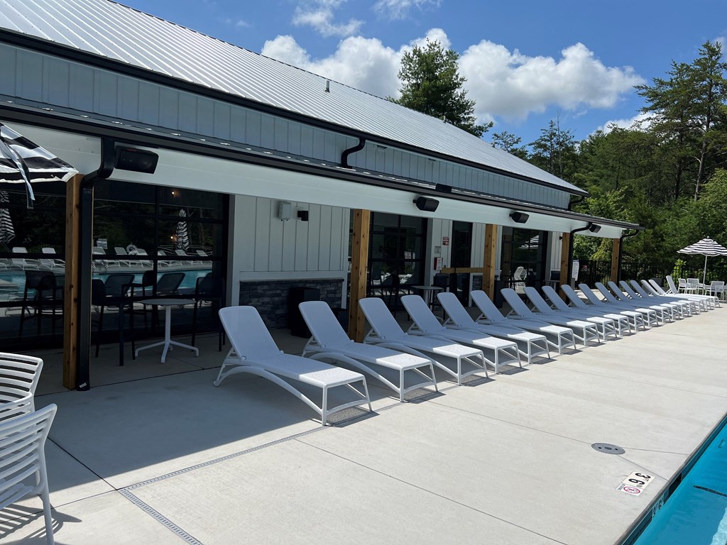 a poolside bar and lounge area at the lodge on otter tail lake