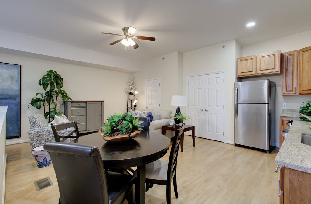 A modern dining room with a table set for four.
