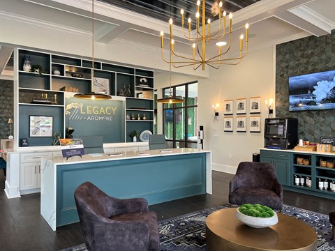 a lobby with a reception desk and chairs