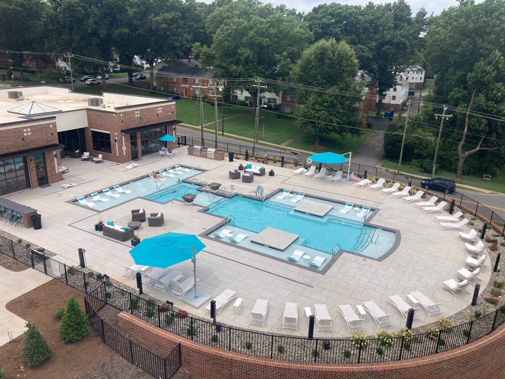 a view of the pool from the balcony of our hotel