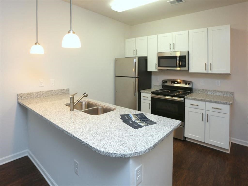 a kitchen with a counter top and a sink