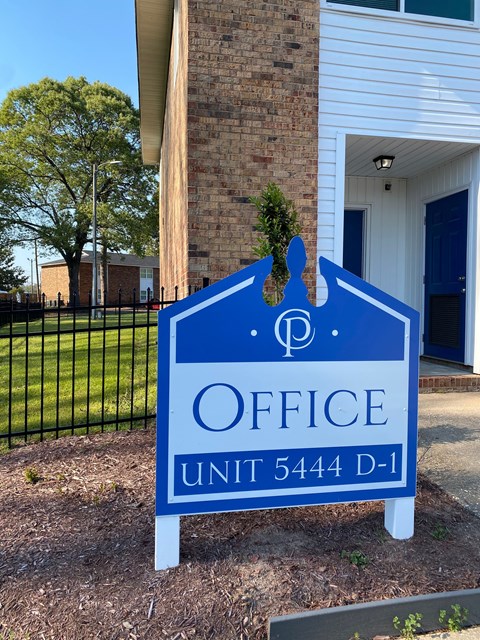 A blue and white sign that says Office and Unit 5444 D-1.