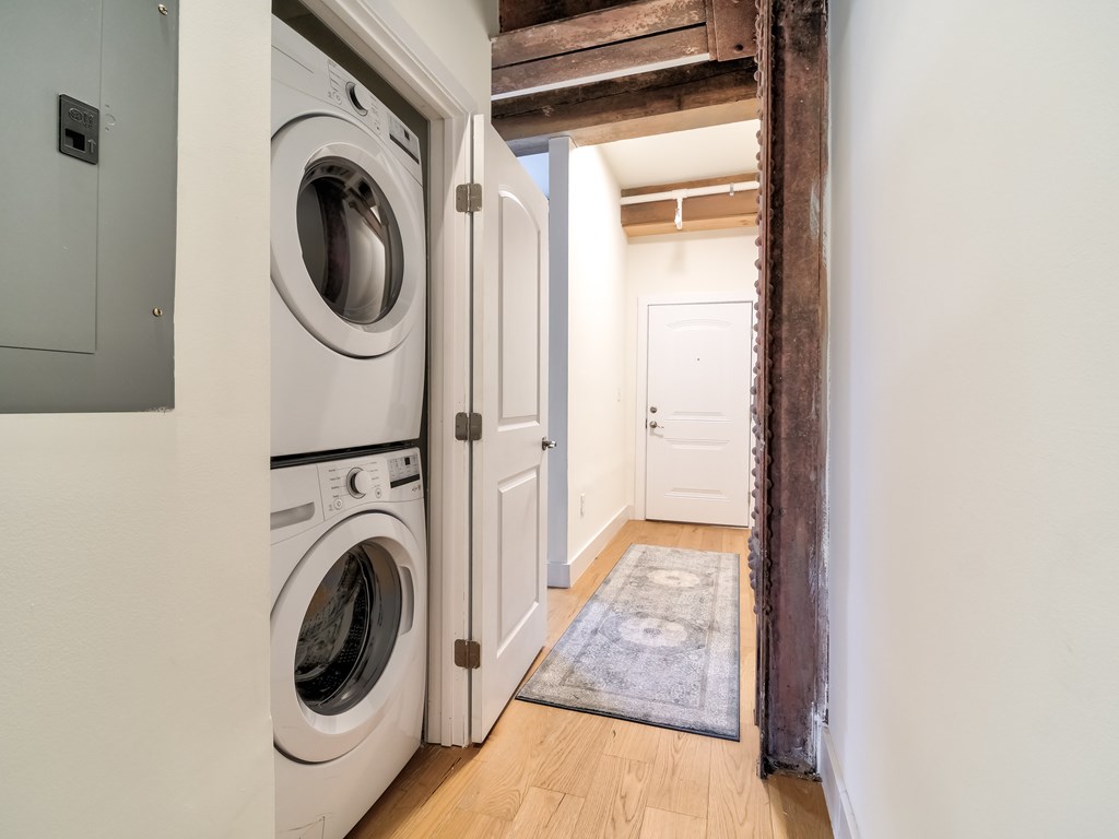 A laundry room with a washer and dryer in it.