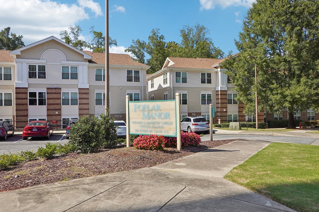 A building with a sign that says "Parker House" in front of it.