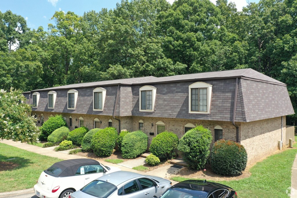 a house with cars parked in front of it