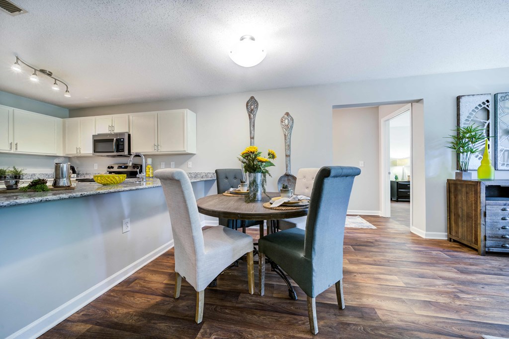 Dining Area with Table and 4 chairs visible from the kitchen area