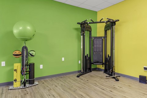 A gym with a green wall and a yellow wall.