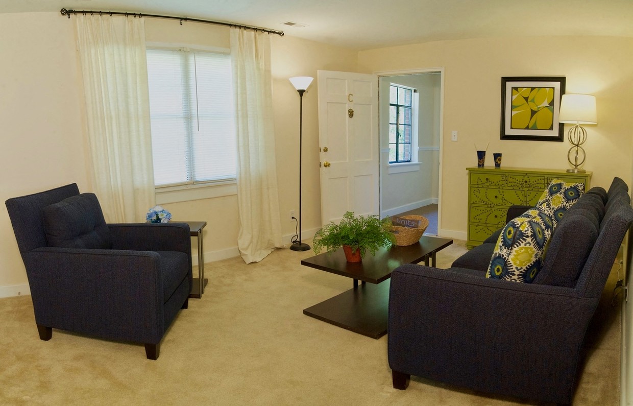 a living room with couches and a table