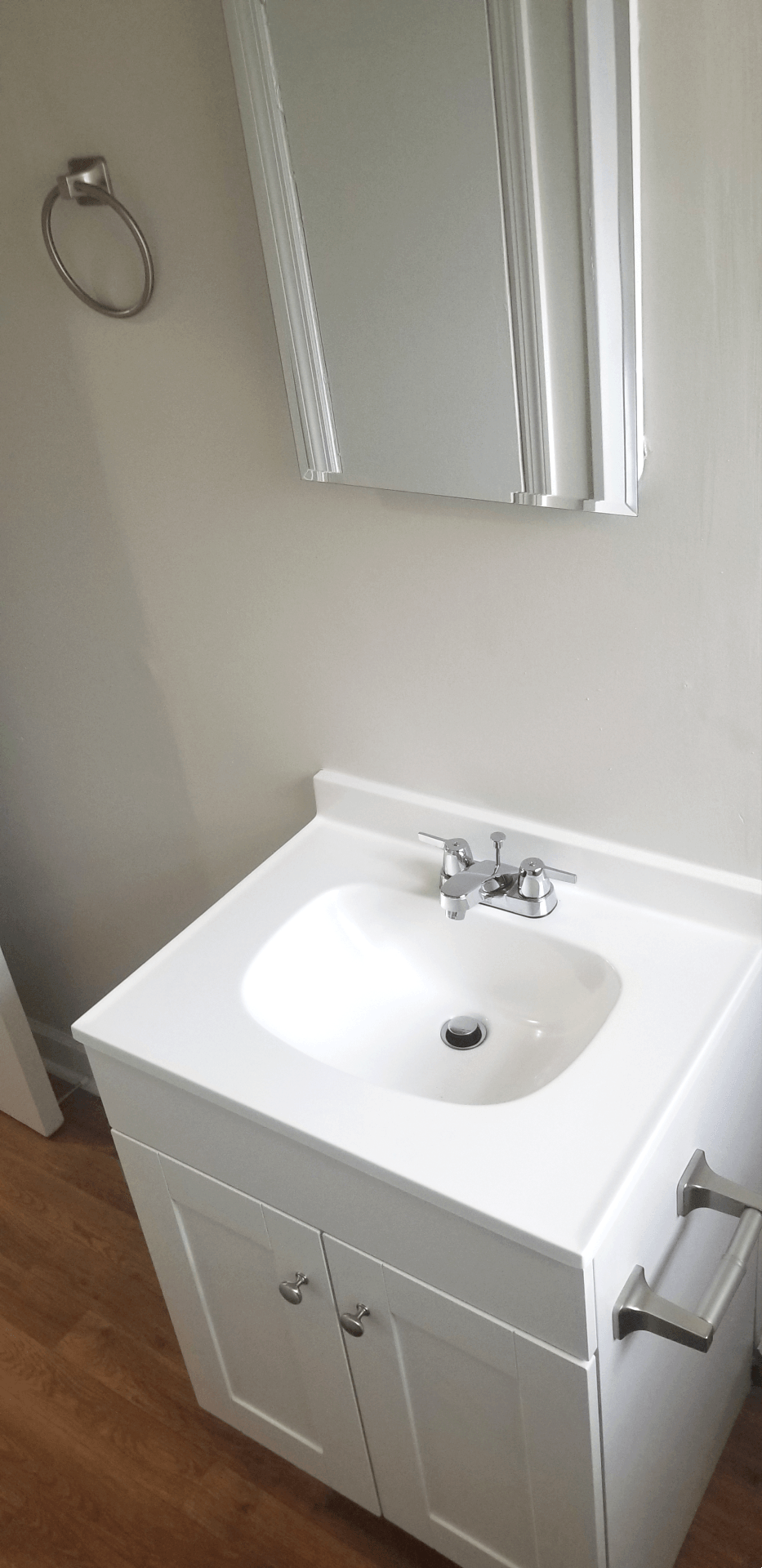 a small bathroom with a sink and a mirror