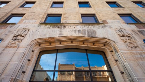 A building with the word "Washington" carved into its facade.