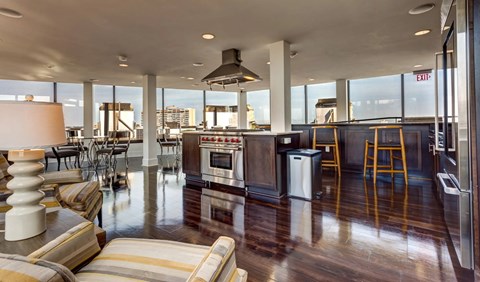 A modern kitchen with a view of the city.